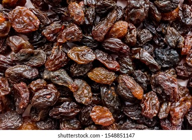 Top view of black raisins (sultana), dried fruits close-up. Closeup brown raisins. Food background - Shutterstock ID 1548851147
