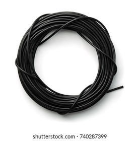 Top view of  black rolled cable isolated on white