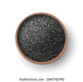 Top view of black salt in wooden bowl isolated on white