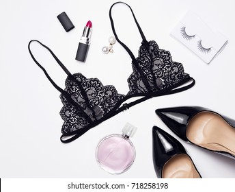Top view black underwear bra lingerie. Female essential accessories on flat lay.