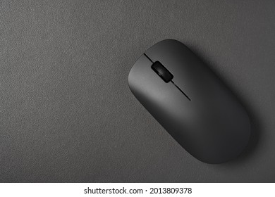 Top View Black Wireless Mouse On A Dark Background