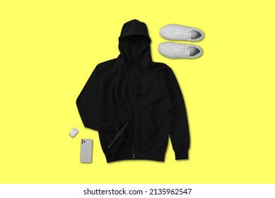 Top View Of Black Zip Hoodie With Shoes, Cell Phone, Earbuds With Flat Lay Concept