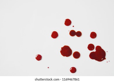 Top View Of Blood Red Spread On White Ground.