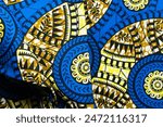 top view of blue ankara fabric, flatlay of nigerian wax cloth with designs, spread out blue ankara material