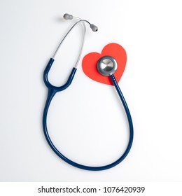 Top View Blue Stethoscope On White Background. For Check Heart Or Health Check Up Concept