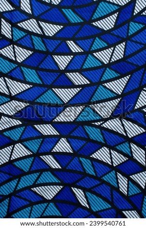 top view of blue and white ankara fabric, flatlay of nigerian wax cloth, rumpled blue and white ankara material