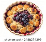 Top view of a blueberry cobbler with a golden crust, isolated on white background.