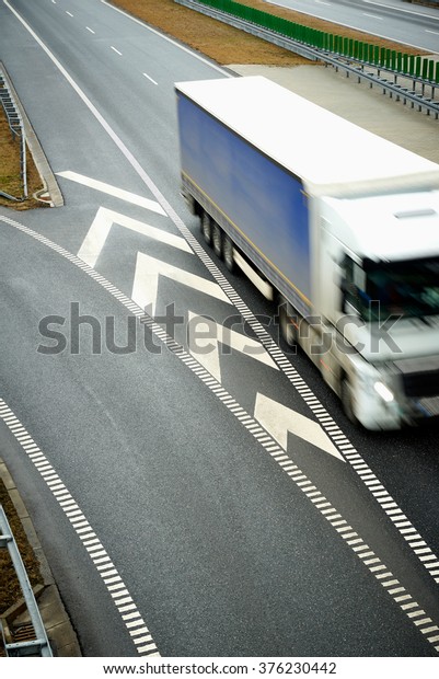 Top view of blurred truck driving on a\
highway. Presentation of speed in\
transport.\
