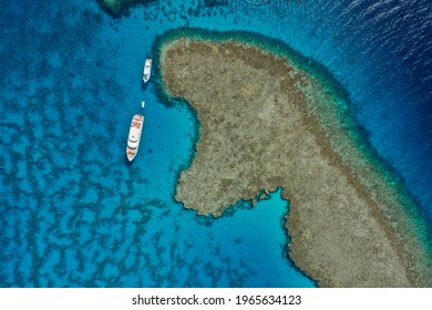 Top view: Boat and coral reef, Red sea Egypt

