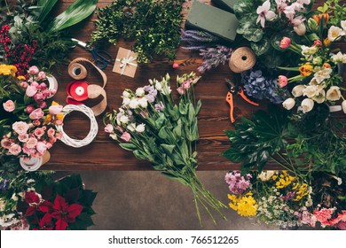 Top View Of Bouquet Of Roses On Florist Table