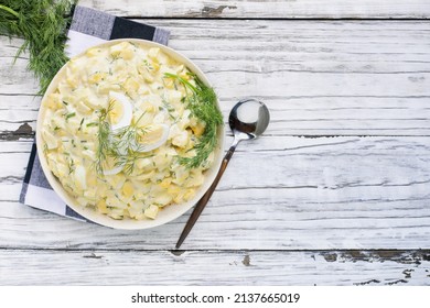 Top View Of A Bowl Of Egg Salad Sandwich Spread With Fresh Boiled Eggs And Dill Over A Rustic Wood Table Background. Overhead View.