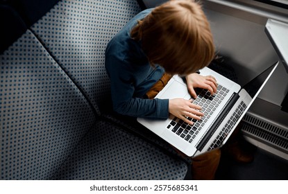 Top View of Boy Typing on Laptop.