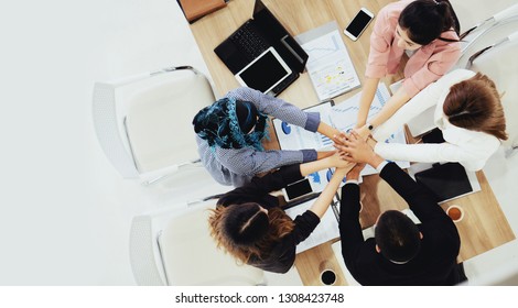 Top view Brainstorm Meeting and agreement of mixed race business people join hands. Unity building for successfully work and achieved goal. Teamwork to reach the target. Concept Collaboration