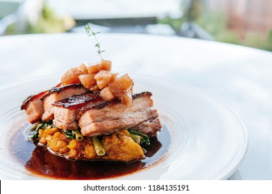 Top View Of Braised Pork Belly In Brown Sauce With Vegetables, Modern Chinese Cuisine In Fine Dining Restaurant.