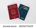 Top view of brazilian and italian passport on white background. Dual citizenship concept.