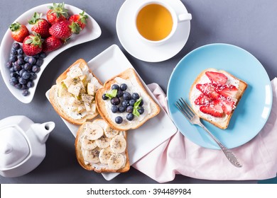 Top View Of Breakfast Table With Toast, Tea, Berries