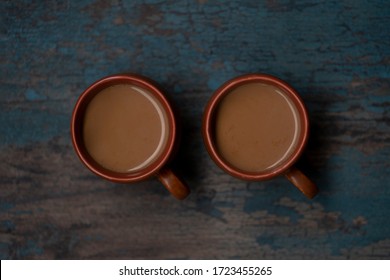 Top View Of Brewed Hot Aromatic Milk Tea From India. Two Cups Of  Chai Is Good In Winter For Immunity Boosting And Health, Top Angle.