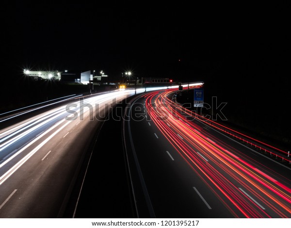 Top view from bridge to the highway at\
Pfaffenhofen during night with a long exposure\
time