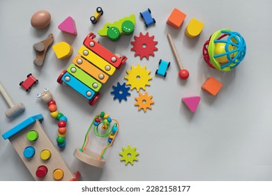 top view of bright children's wooden and plastic montessori toys for early development