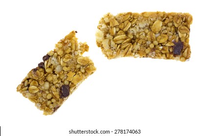 A Top View Of A Broken Granola Bar On A White Background.