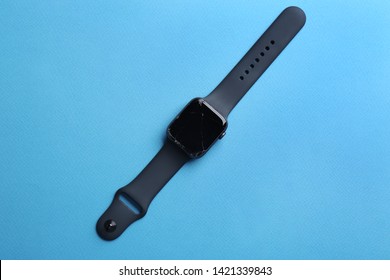 Top view of broken smart watch on color background. Repair service - Shutterstock ID 1421339843