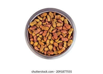 Top View Of Brown Kibble Pieces For Cat Feed In A Metal Bowl Isolated On White Background. Healthy Dry Pet Food