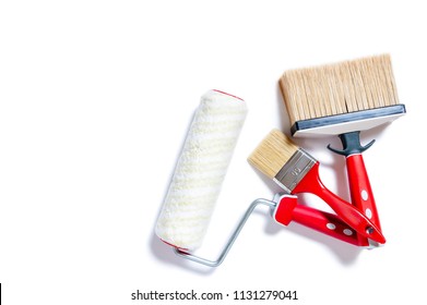 Top View Of Brushes And Roller For Professional House Painter, Photographed On White Background