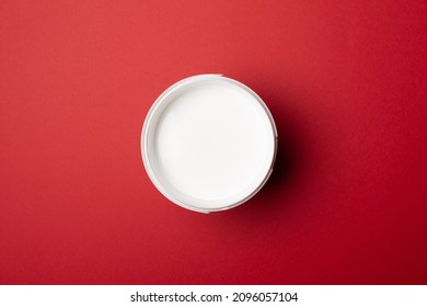 Top View Of Bucket With Paint On Color Background.