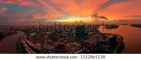 Top View of Building in a City - Aerial view Skyscrapers flying by drone of Phnom Penh city with downtown , riverside and sunset Stok fotoğraf © 