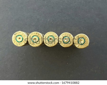 Top view of bullet shells.  You can read the caliber text of the projectiles.