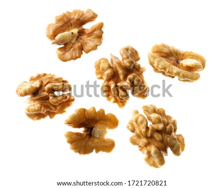 Top view of bunch of nutrient fresh walnuts without shell isolated on white background