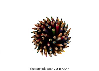 Top View Of A Bunch Of Sharpened Color Pencils Standing In A Pencil Holder Isolated On A White Background.