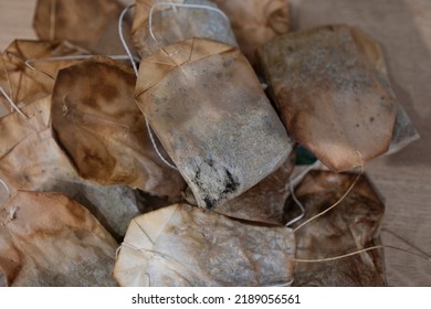 Top View Of A Bunch Of Used Tea Bags. Several Used Tea Bags In A Heap. Used Tea Bags For Re-using As A Compress, To Acidify Oil, To Revitalize Puffy Eyes, A Facial Steam, Deodorize A Fridge