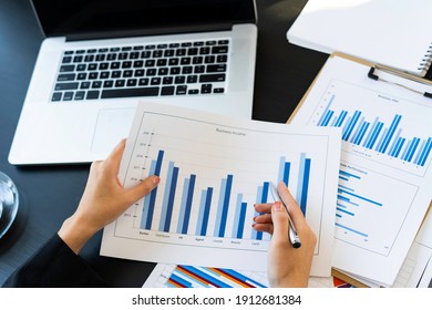 top view of Business consultant meeting to analyze and discuss company performance On financial report paper Investment advisor, financial advisor, and accounting concept