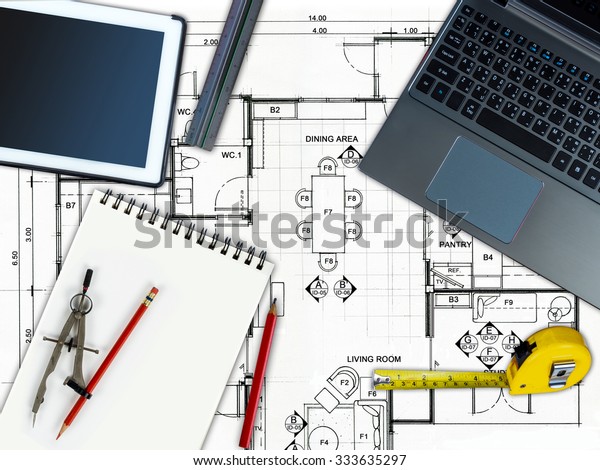 Top view\
of Business office table with home decoration and renovation\
concept  over architecture planning\
background