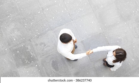 Top view of business partners shaking hands 