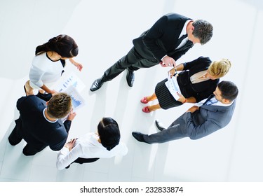 Top View Of Business People With Their Hands Together