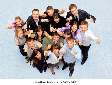 Top View Of Business People With Their Hands Together In A Circle