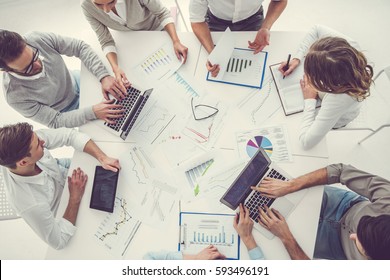 Top View Of Business People Using Gadgets During The Conference