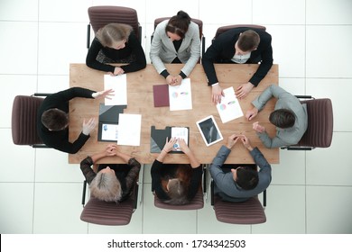 Top View. Business Team Meeting At The Office Table.