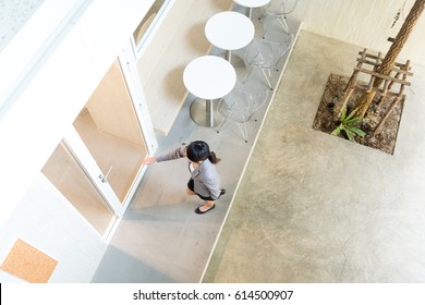 Top View Of Business Woman Entering The Office