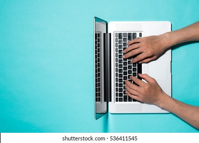 Top View Of Businessman Hands Busy Using Laptop At Office Desk, With Copyspace