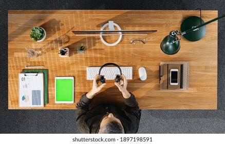 Top View Of Businessman Working On Computer At Desk With Keyable Screen In Home Office.