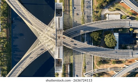 Top view of cable-stayed bridge, Marginal Pinheiros, and Pinheiros river in Sao Paulo city.