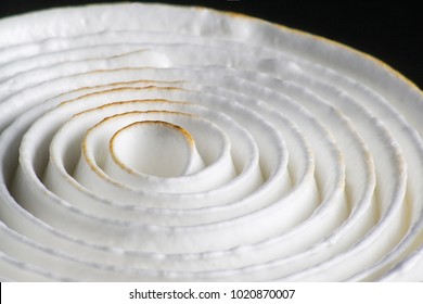 Top View Of Cake Decoration With Spiral Meringue, Closeup Studio Shot On Black Background