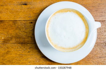 Top Of View Cappuccino Coffee On Wood Table