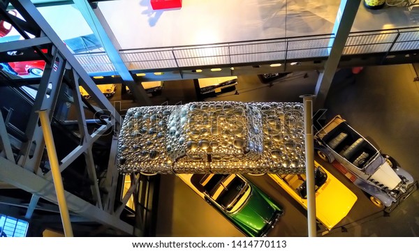 Top view of a car covered with steel plates. Unique\
concept of modern car. Model of car covered with reflecting metal.\
Heritage Transportation Museum Gurgaon, Haryana/India - September\
26, 2018.