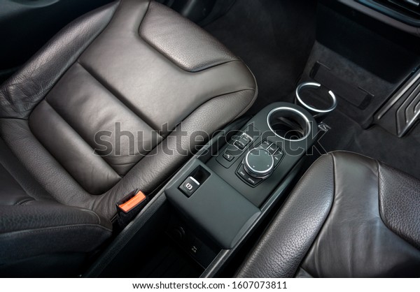 Top view of Car\
Interior with Driver, Passenger seat and cup holder on background.\
Modern Car Interior Design.