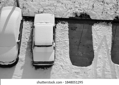 Top View Of The Car Parking Covered By Snow