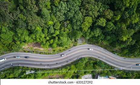 Top view car and road on the hill in Phuket, Thailand. Aerial view from flying drone.